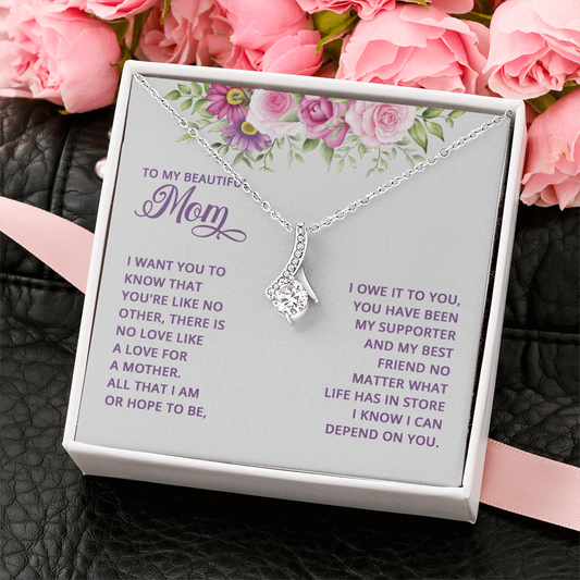 Alluring Beauty necklace for Mom with a message card that reads "All that I am or hope to be, I owe it to you" inside a gift box
